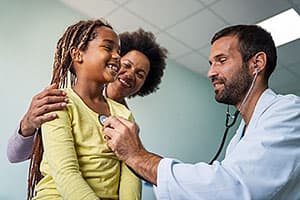 Medicaid doctor examining young girl